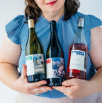 Friends holding all three Amabile di Rosa bottles for a celebration
