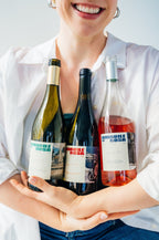 Friends holding all three Amabile di Rosa bottles together