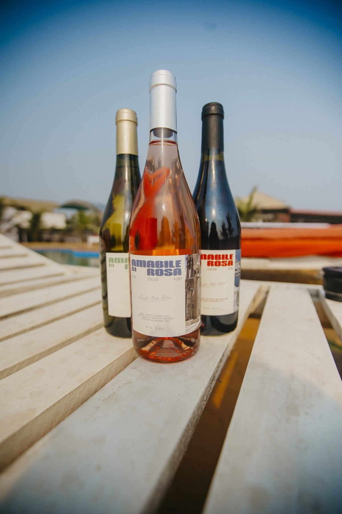 Amabile di Rosa bottles poolside